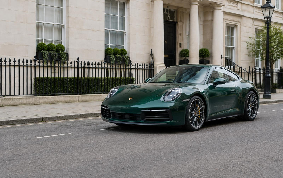 Green Porsche 911 on a London street